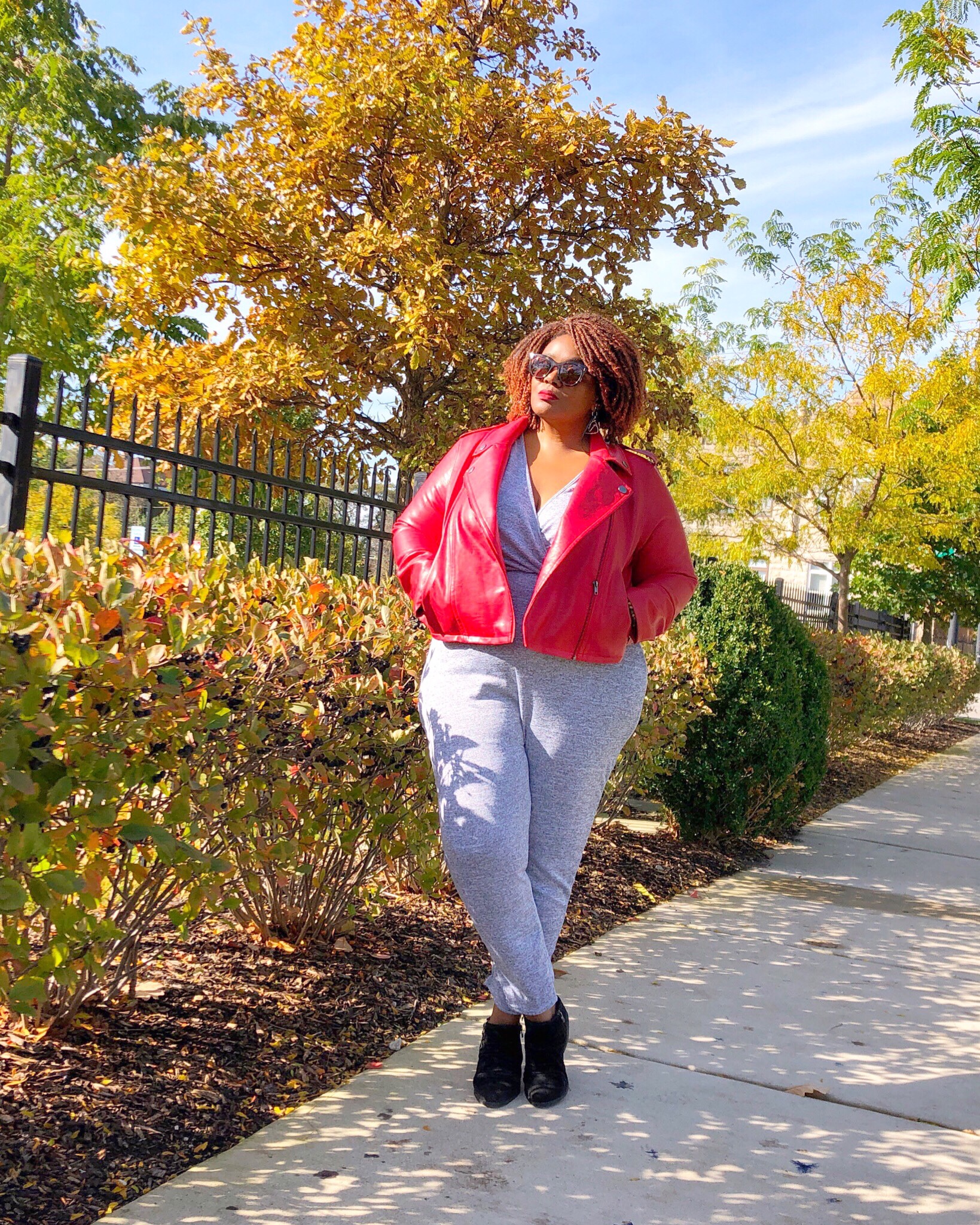Plus size faux leather moto jacket jumpsuit and ankle booties